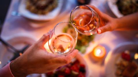 Couple Toasting Wine Glasses at a Romantic Dinner Evening in Lake Tahoe