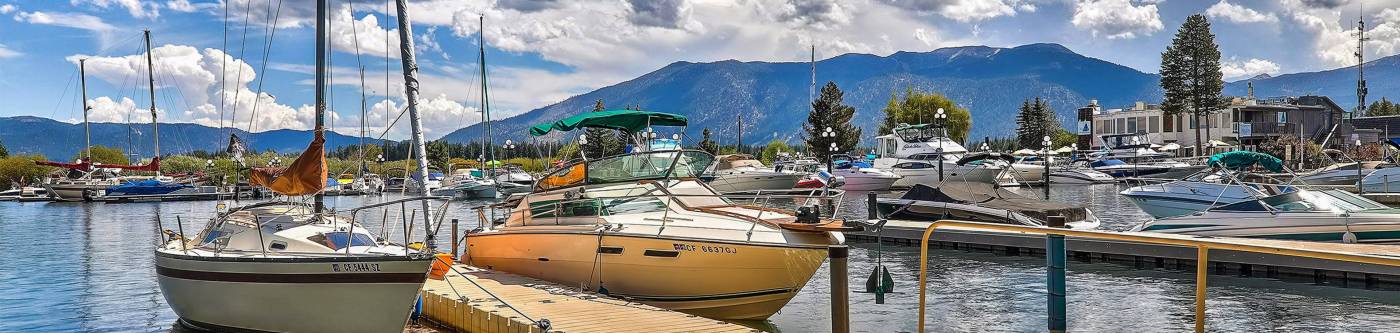 Tahoe Keys community with multiple boats parked next to docks on South Lake Tahoe.